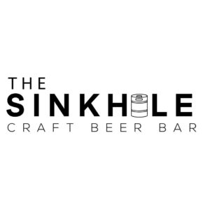 Black and white logo of The Sinkhole Craft Beer Bar, featuring bold typography with a beer keg icon replacing the letter "O" in "Sinkhole."