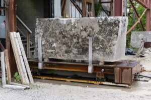 A large limestone block on the saw bed at the mill