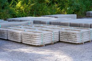 Pallets of limestone paving and retaining wall stone in the yard