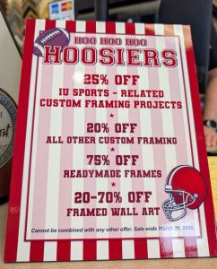 Promotional sign at Framemakers in Bloomington, Indiana, offering IU sports-related and custom framing discounts through March 31, 2026