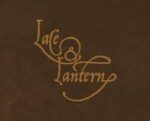 Logo for Lace & Lantern Tattoo Studio in Bloomington, Indiana, featuring ornate gold script on a dark brown background