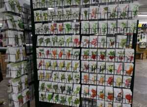 A tall rack of seed packets at Mays Greenhouse