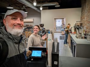 Baristas working behind the counter at Soma Coffeehouse in Bloomington, Indiana