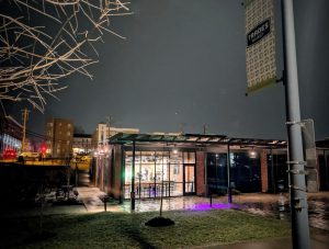 Soma Coffeehouse & Juice Bar in Bloomington Trades District at night near The Mill