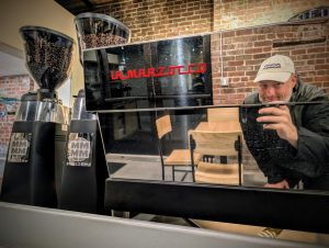 Espresso bar at Soma Coffeehouse featuring La Marzocco machine and Mazzer grinders in Bloomington, Indiana