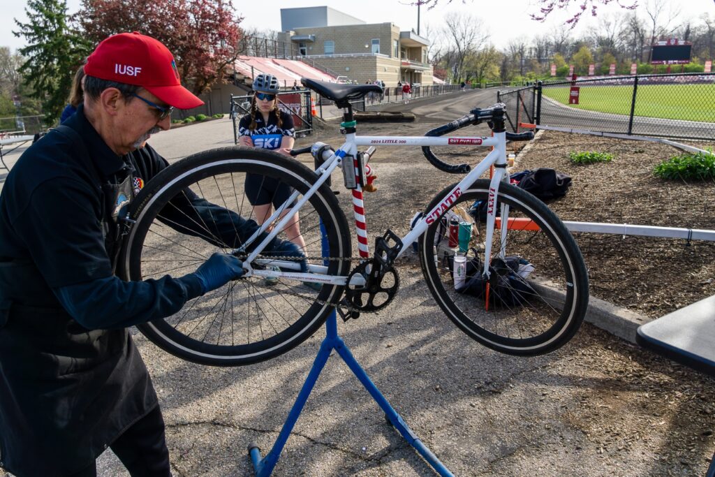Greg Souder meticulously adjusts the chain of a Little 500 race bicycle.