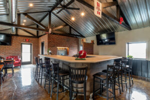 The U-shaped bar and brick walls inside The SIP Craft Beer Pub