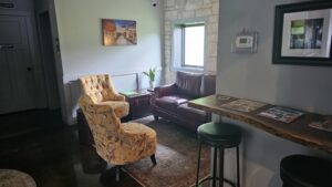 Couch and chairs in the lounge corner at The SIP Craft Beer Pub